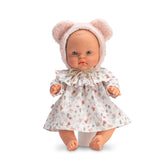 36 cm ASI Doll from Snail Collection with light eyes, bald head, wearing floral dress and pink bear-ear hat.