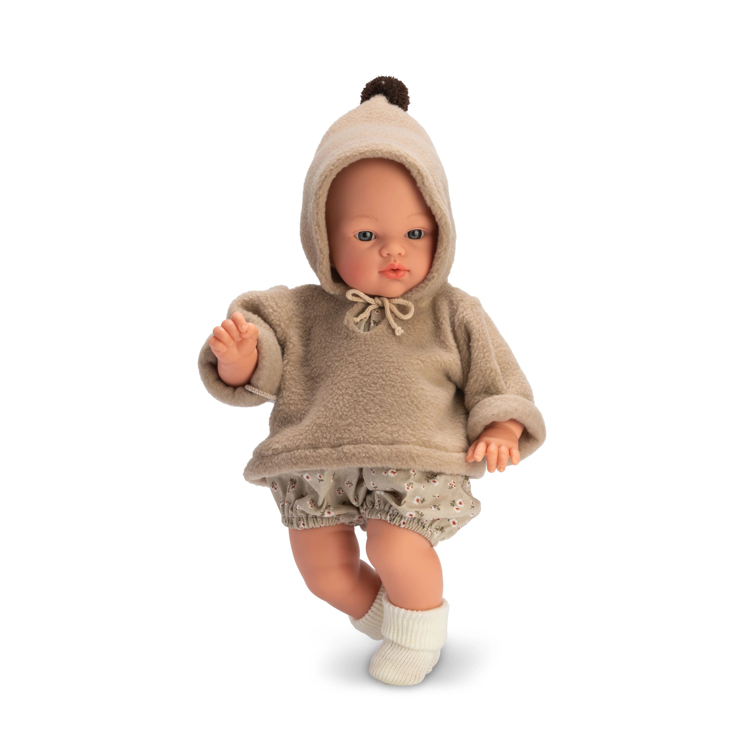 Koke doll in beige hooded sweatshirt and floral shorts, featuring a soft, huggable body and clear eyes.