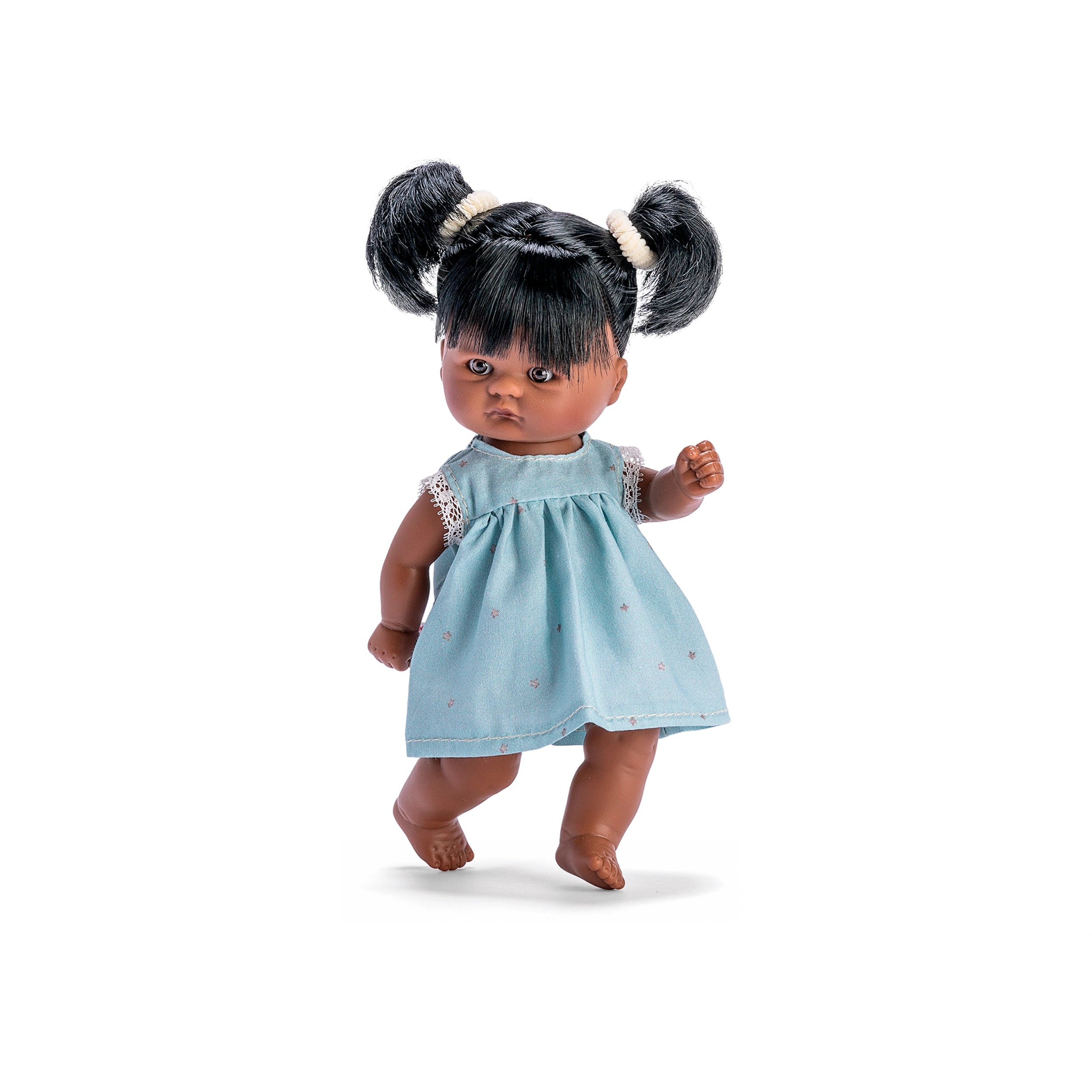Cute ASI Dolls' Tom wearing a star-patterned blue dress, featuring black hair in pigtails, standing on one foot.
