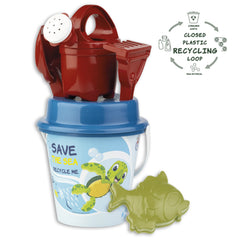 Eco-friendly beach set with blue bucket and turtle design, red rake, and green fish mold, promoting recycled materials.