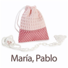 Pink bag with white stars and a pacifier for María and Pablo dolls.