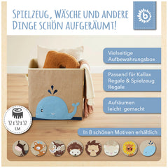 Whale storage box in sand and sky blue with a playful design, filled with blankets, placed on a wooden floor in a child’s room.