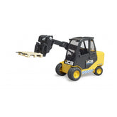 Yellow and black Bruder JCB Teletruck toy with telescopic arm and pallet on white background.