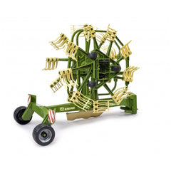 Green and yellow Bruder Krone dual rotary swath windrower toy with detailed spinning mechanism.