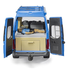 Blue MB Sprinter camper toy with open doors, revealing a driver figure lying on a double bed and a storage compartment.