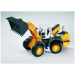 Bruder Liebherr L574 toy loader, orange and black, large front shovel, articulated design, for imaginative construction play.