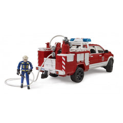 Red and white toy fire truck with blue lights and hose, accompanied by a firefighter figure in blue gear.