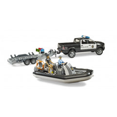Bruder RAM 2500 Police Pickup with trailer and boat, featuring figures, in a detailed toy set.