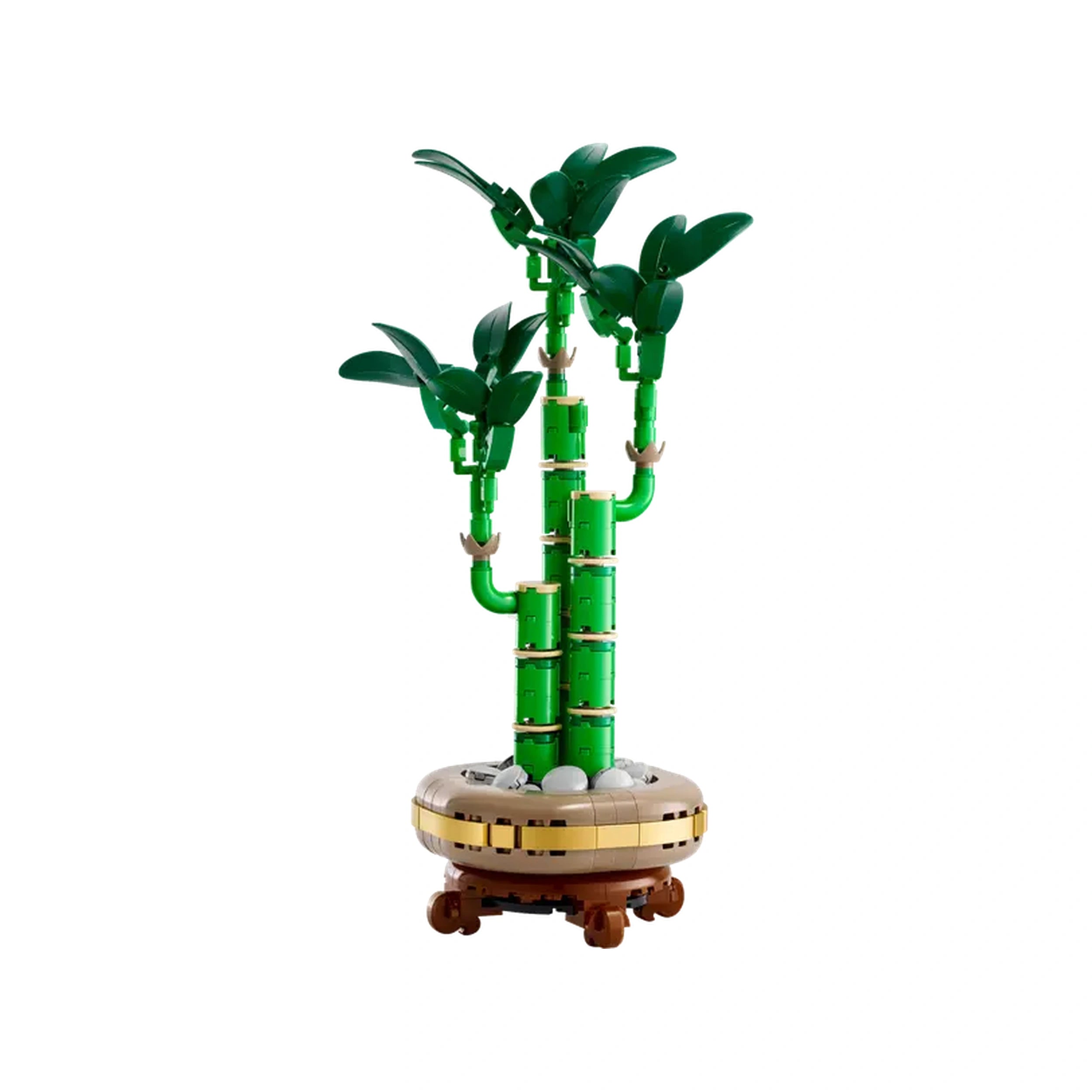 Three green bamboo stems rise gracefully from a round, brown pot adorned with pebbles, capturing the serene essence of nature.