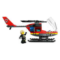 LEGO City Fire Rescue Helicopter in vibrant red, featuring spinnable rotors, water element launchers, and a firefighter pilot minifigure waving.
