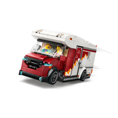 LEGO City Holiday Adventure Camper Van in red and white, featuring cartoonish characters inside, ready for imaginative trips.