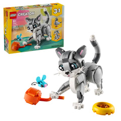 LEGO® Creator 3in1 Playful Cat set featuring a posable gray cat with a pink nose and ears, surrounded by a toy mouse, ball of yarn, and food bowl.