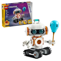 LEGO Creator Space Robot toy with track wheels, blue balloon, and light-up features, displayed next to its colorful box packaging.