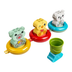 Colorful LEGO® DUPLO® Floating Animal Train set with a green hippo, yellow duck, and white polar bear on vibrant rings, plus a small green bucket.