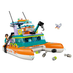 Colorful LEGO® Friends Sea Rescue Boat toy with a buildable catamaran, ladder, mini-figures, and waste collection elements.