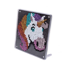 A colorful unicorn-themed sequin art activity featuring a shiny, textured surface with vibrant shades of purple, blue, orange
