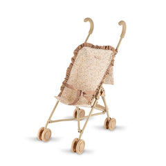 ASI Dolls Dreams Stroller features a vintage wooden high chair with floral fabric, cushioned seat, and rolling wheels.