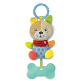 Baby Clementoni's Lovely Soft Dog Rattle features a plush dog with a red heart-patterned bandana, hanging from a blue ring.