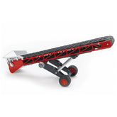 Red and black Bruder conveyor belt toy with crank and wheels, designed for imaginative play and motor skill development.