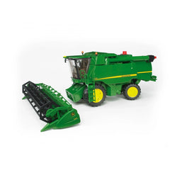 Green Bruder John Deere T670i combine harvester toy model with detailed features and detachable header on a white background.