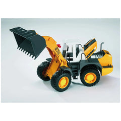 Bruder Liebherr L574 toy loader, orange and black, large front shovel, articulated design, for imaginative construction play.