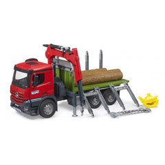 Red Bruder MB Arocs timber truck toy with loading crane, green bed, and three logs, on a white background.