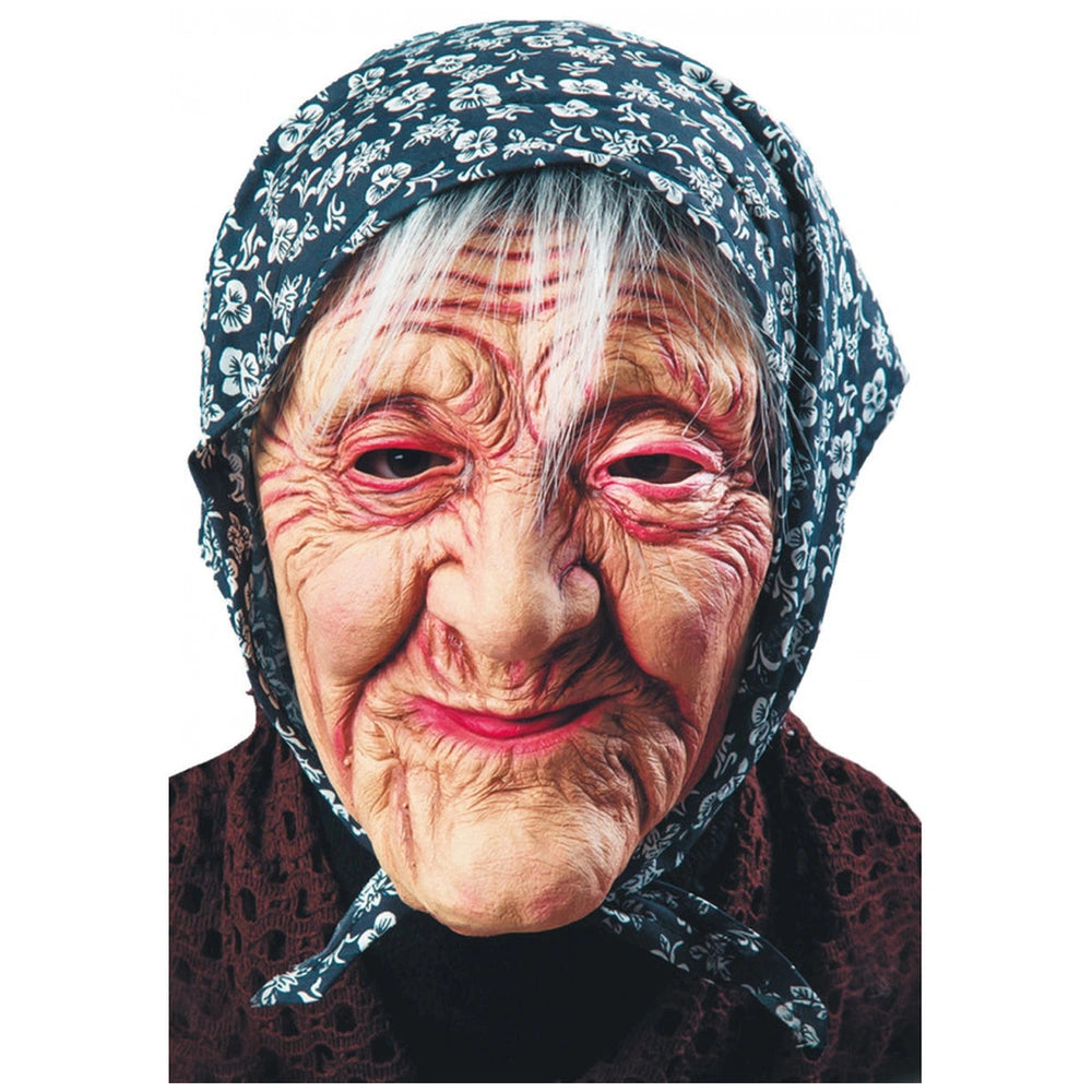 Befana latex mask worn by a person with white hair and red makeup, featuring a floral-patterned headscarf and dark garment.