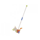Eichhorn Duck push toy features a vibrant design with a long handle, bright colors, and a playful cartoonish appearance.