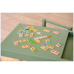 Eichhorn Wooden Domino Game featuring colorful tiles with illustrations for childrens educational play on a green tabletop.