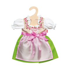 Heless Dirndl Heidi dress in pink with a white bodice and green trim, hanging on a light wooden hanger.