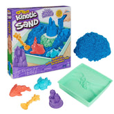 Kinetic Sand Sandbox Set features a green tray filled with bright blue sand and various flexible molds, all in a purple box.