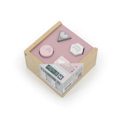 Wooden shape-sorting box for babies with a pink interior and a white plastic lid featuring a heart-shaped cutout.