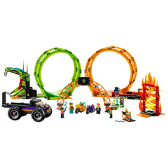 LEGO City Double Loop Stunt Arena featuring two vibrant loops, a monster truck, stunt bikes, and seven minifigures preparing for action.