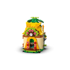 Colorful LEGO® Moana’s Island Fun playset featuring a charming house adorned with flowers, green leaves, and a bright yellow roof.