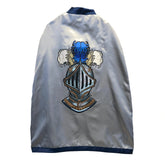 Liontouch Mystery Knight Cape in glossy blue fabric with dark blue trim, featuring a shiny metallic helmet and sword.