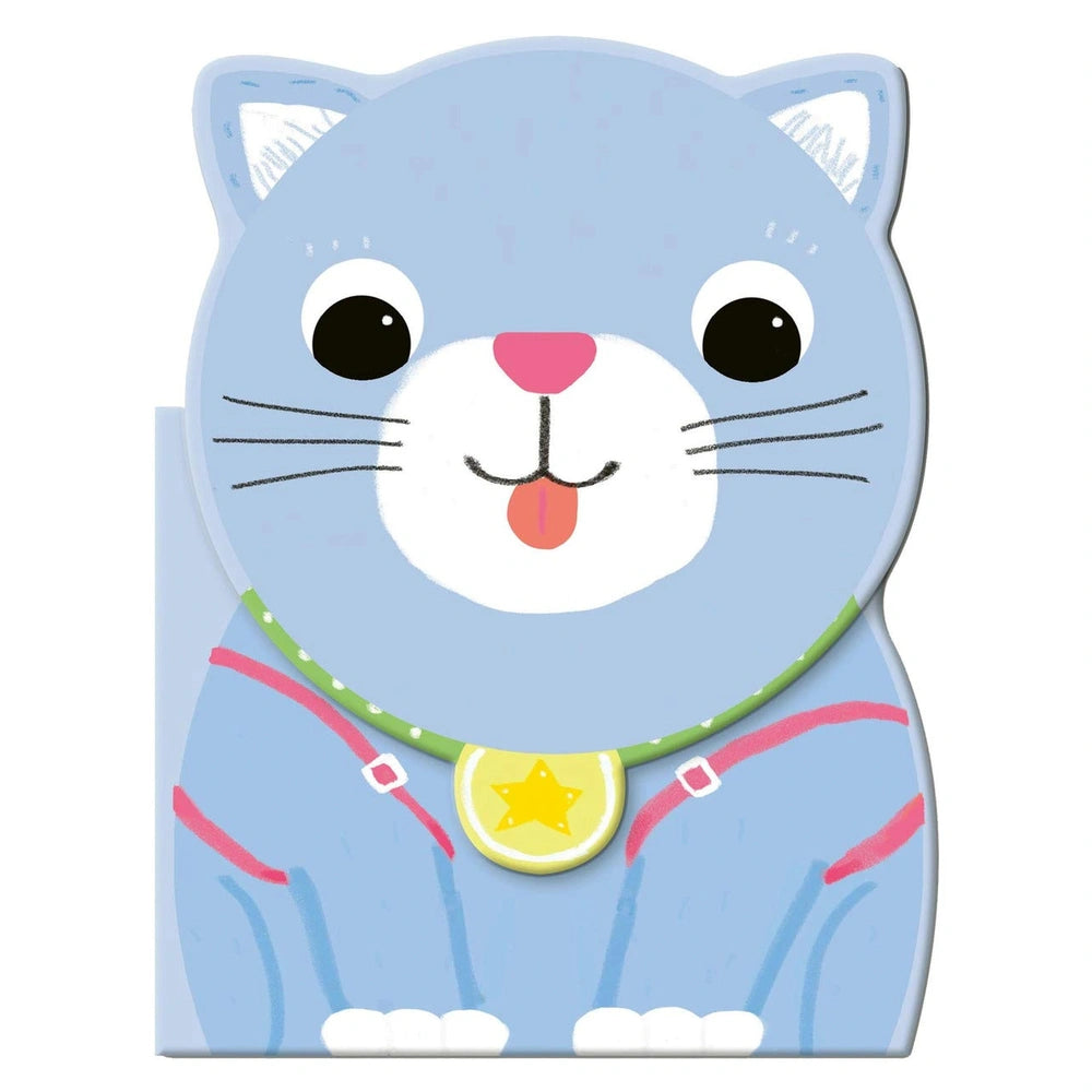 MACRO JUNIOR book featuring a matte-furred cat with pink features and a colorful star collar on a flat surface.