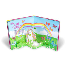NUINUI Unicorni Super Pop-Up book packaging features a rainbow, unicorn, butterflies, and sun, with glossy plastic window.