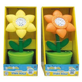 Flower Bubble Machine packaging features two green flower pots with orange petals and white centers, all set against a yellow
