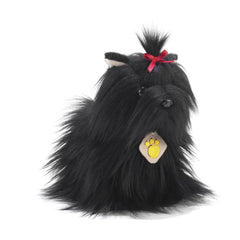 Keyran Little Black Yorkshire Terrier plush with fluffy texture, red bow, and yellow paw print tag on a light background.
