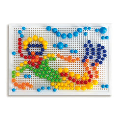 Quercetti FantaColor Portable features colorful plastic beads arranged on a white perforated surface resembling a person's bo