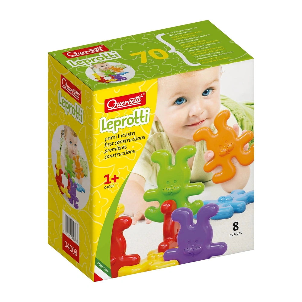 Quercetti Leprotti baby activity toy set in colorful interlocking pieces, displayed in glossy yellow cardboard packaging.