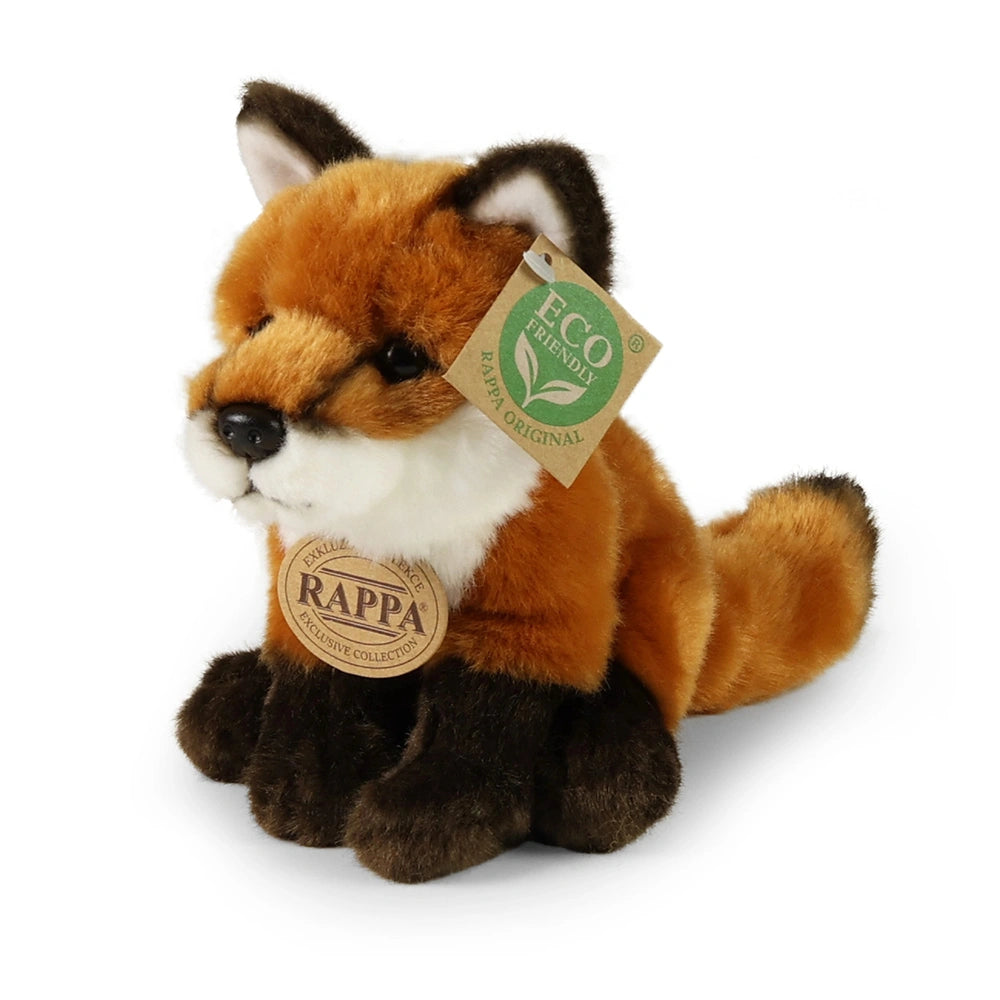 Plush fox toy in orange and white with brown accents, featuring an eco-friendly tag, sitting upright on a light background.