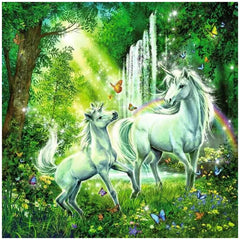 Beautiful unicorns in a vibrant forest with flowers, butterflies, and a serene waterfall create a magical puzzle scene.