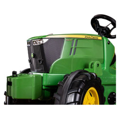 the tractor's body, showcasing its John Deere branding and model 7310R design.