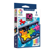 Smart Games IQ Waves packaging features a blue design with a clear window showcasing colorful wave-like game components.