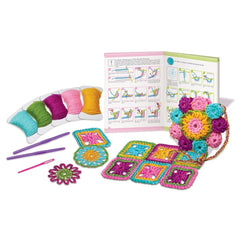 4M Crochet Art kit featuring a matte booklet, colorful yarn spools, a purple plastic hook, and a multi-colored crochet flower