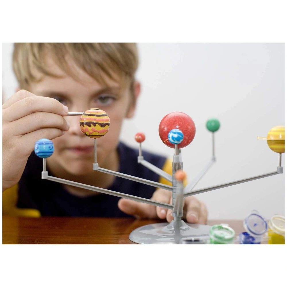 KidzLabs planetarium craft project features colorful paper and plastic components, including a central sphere and smaller sph