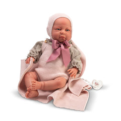 Lifelike 46 cm Katty Reborn Doll wearing pink knit outfit with a bow, resting on a matching blanket, with a pacifier nearby.