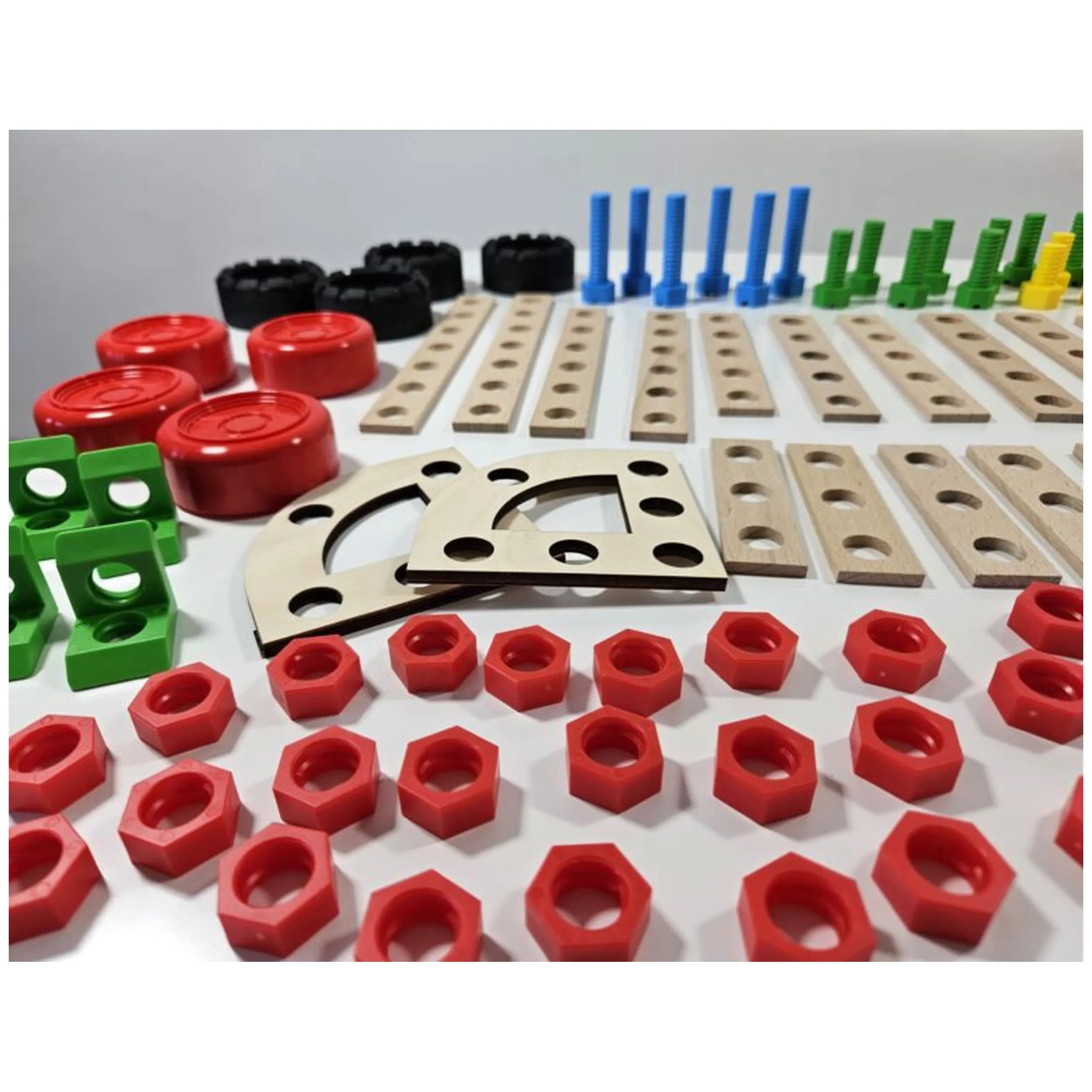 Colorful construction toy pieces including wooden boards, red nuts, green and black connectors, and blue bolts.