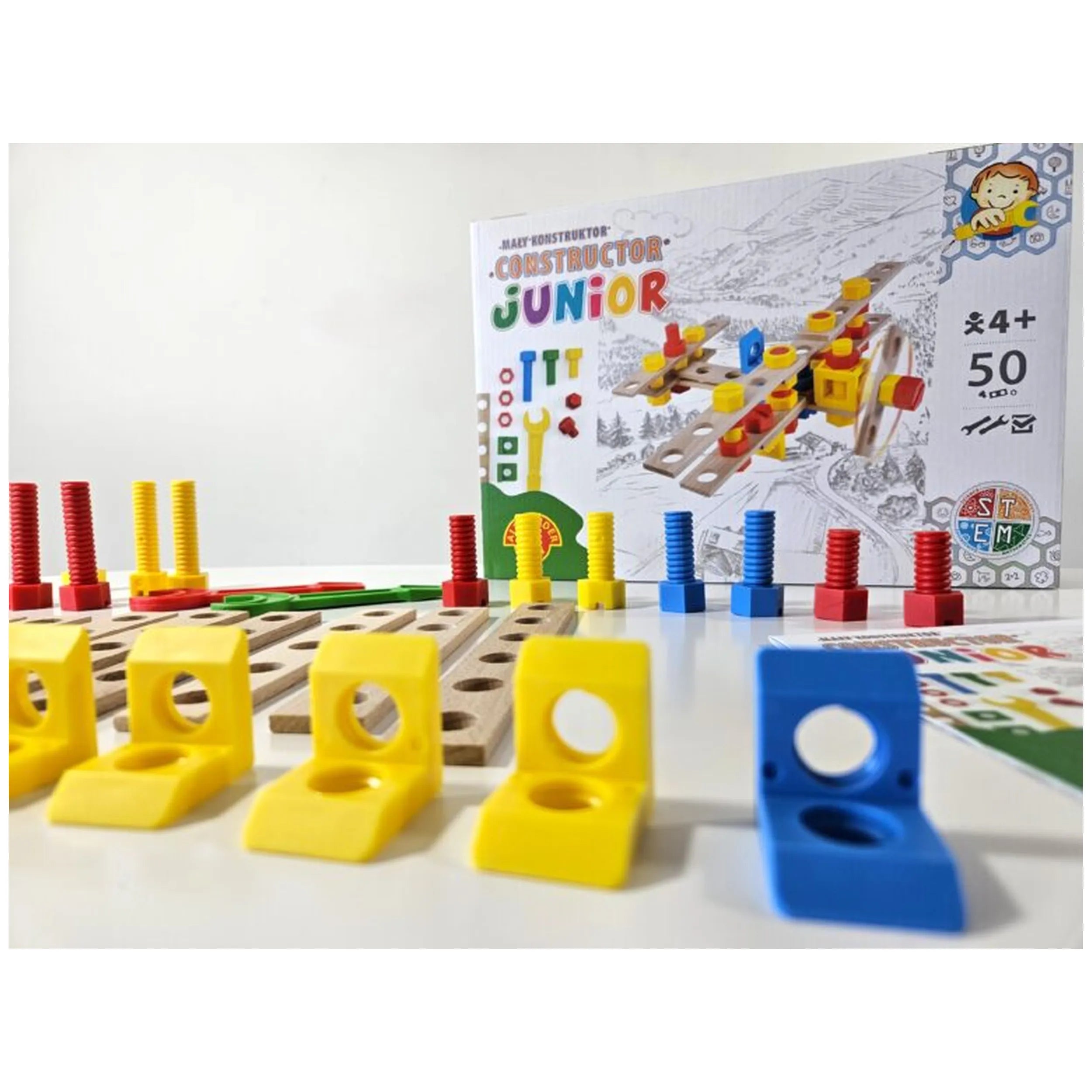 Colorful wooden airplane construction set with yellow and blue brackets, red and yellow screws, and box displaying assembly.